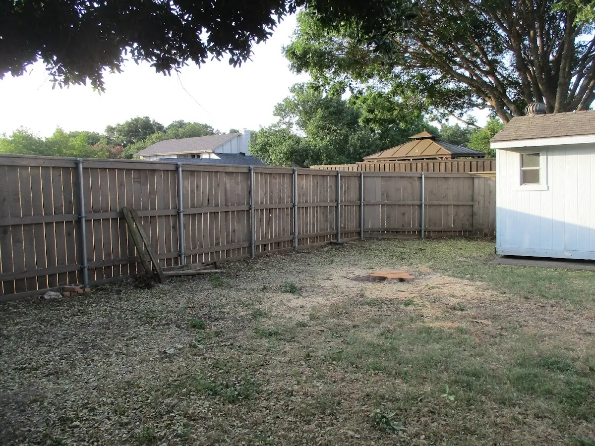 Cleared yard after professional tree removal in Happy Valley